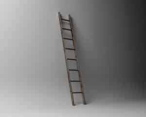 A ladder is positioned against a wall. 