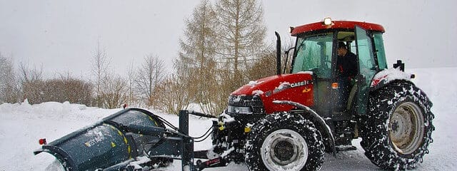 tractor pushing snow