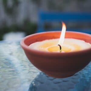 citronella candle to repel mosquitoes in backyard