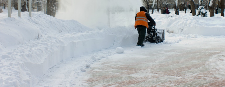 man working with Senske's Kennewick Snow Removal team removes snow in kennewick washington