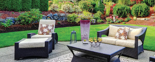 outdoor patio with landscaped yard